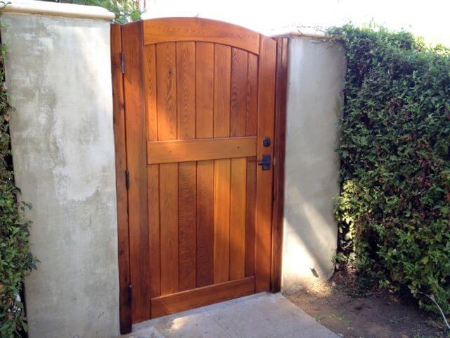 What are some unique wood gate design ideas?