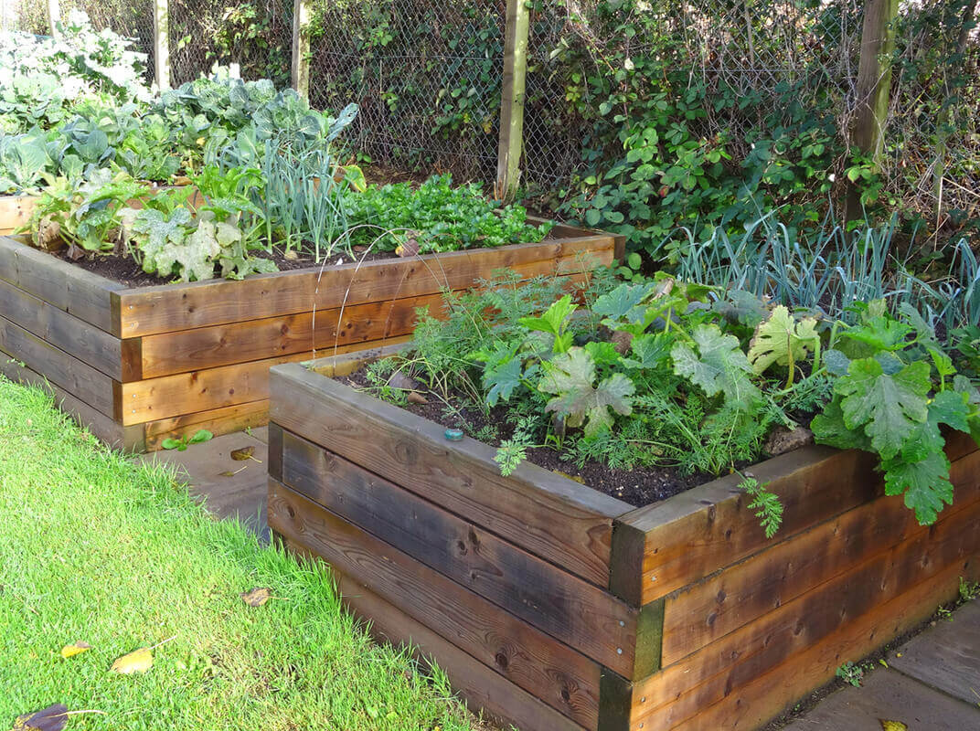 Landscape Showdown: Railroad Ties Vs. Timber Landscape Showdown: Railroad Ties Vs. Timber